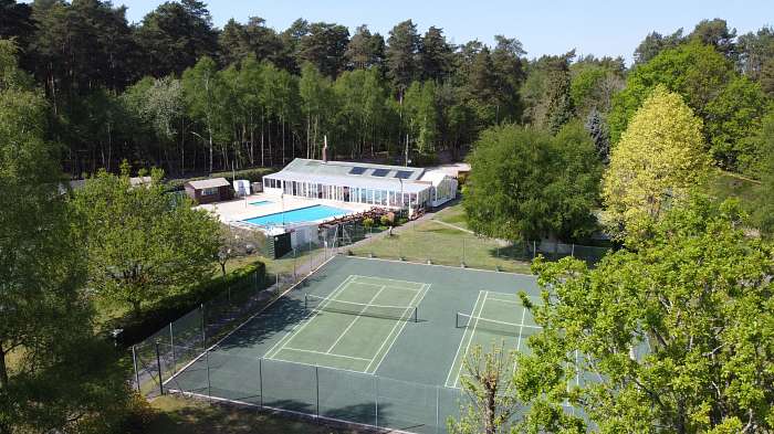 Heritage Club - Our beautiful outdoor heated pool - Just some of our lush grounds - Our clubhouse - Play park - Our cherry tree that inspired our Heritage logo - Hardstanding pitch 6a - The heated pool - Miniten courts